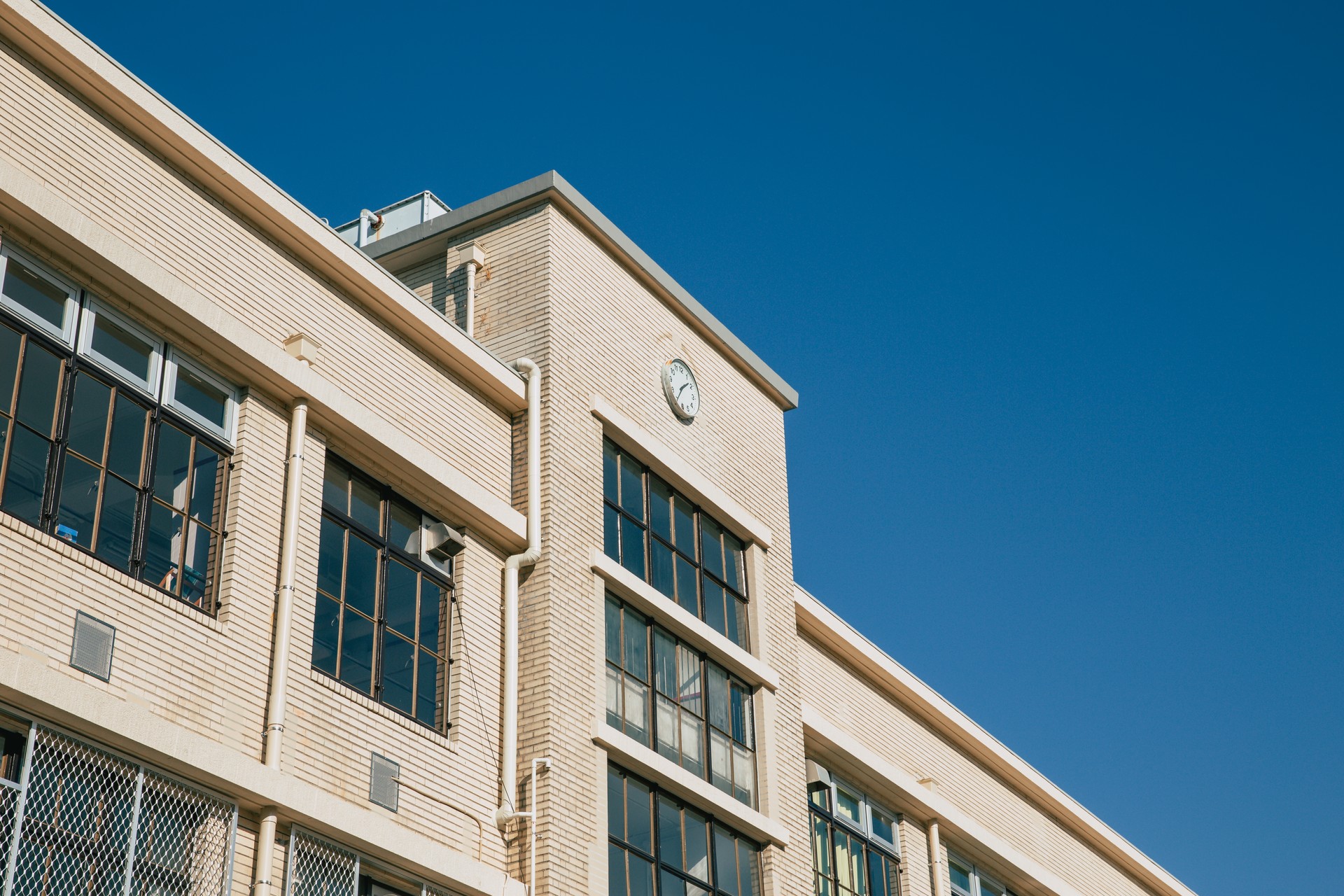 high school facade building in japan traditional style visible in cartoon